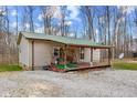 View of the home's rear elevation, showcasing the wooden deck and outdoor space at 4976 W Sims Ln, Monrovia, IN 46157
