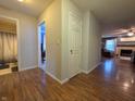Open hallway featuring wood flooring and access to bathroom and living areas at 5848 Jackie Ln, Indianapolis, IN 46221
