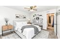 A staged primary bedroom showcases neutral colors and floating shelves for added decor at 5855 La Fleur Ct, Indianapolis, IN 46237
