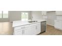 Kitchen island with a white countertop and seating area at 6474 Ambassador Dr, Plainfield, IN 46168