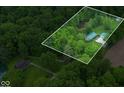 Secluded property nestled amongst mature trees, with a pond and a separate building also on the lot at 685 N Buffalo Hill Rd, Martinsville, IN 46151