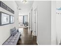 Bright entryway with hardwood floors leading to a cozy living area with lots of natural light at 7901 Apalachee Dr, Indianapolis, IN 46217
