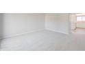Bright bedroom featuring neutral carpeting, fresh paint, and a closet at 8116 Cheswick Dr, Indianapolis, IN 46219