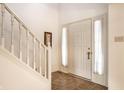 Bright foyer with a staircase, neutral flooring, and a pristine white front door that enhances the welcoming ambiance at 8618 Turnstone Ct, Indianapolis, IN 46234