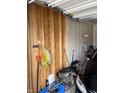 Garage space with exposed framing, containing an engine and car parts at 10931 N Longbranch St, Monrovia, IN 46157