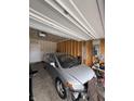 View inside the garage with a car, workbench, and miscellaneous items at 10931 N Longbranch St, Monrovia, IN 46157