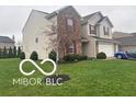 Well-maintained two-story home with beautiful landscaping at 11555 Ross Common Dr, Indianapolis, IN 46229
