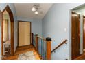 Bright entryway with wood floors, staircase, and convenient coat closet at 1186 Castle Dr, Franklin, IN 46131