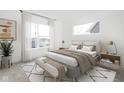 Airy bedroom with a large bed, bench, white walls, and large windows with natural light at 1319 English Ave, Indianapolis, IN 46203