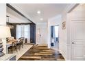 Welcoming foyer with hardwood floors, leading to a dining area and an office space at 15986 Bugle Ridge Dr, Noblesville, IN 46060