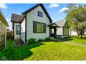 Charming home with manicured lawn and lovely curb appeal at 1917 Fletcher Ave, Indianapolis, IN 46203