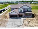 An aerial view showcases the exterior of this new construction home and surrounding neighborhood at 196 Aster Way, Greenfield, IN 46140