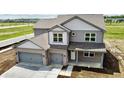 Beautiful two-story home featuring a two car garage and covered entry at 196 Aster Way, Greenfield, IN 46140