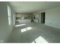 Spacious kitchen features white cabinets and an island at 196 Aster Way, Greenfield, IN 46140