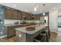Stylish kitchen with granite countertops, stainless steel appliances and island with seating at 19600 Atwater Ave, Sheridan, IN 46069