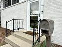 Close-up showcasing the home's front entrance with a charming mailbox, railing, and inviting steps at 210 Prairie Pkwy, Brownsburg, IN 46112