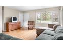 Cozy living room with ample natural light, hardwood floors, and neutral tones at 225 Vali Ct, Carmel, IN 46280