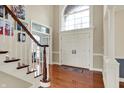 Grand foyer with high ceilings, hardwood floors, and a staircase at 3940 Woodcrest Ct, Westfield, IN 46062