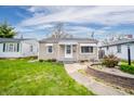 Cozy home with a simple, well-kept front yard and classic exterior design at 4203 Main St, Anderson, IN 46013