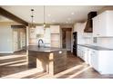 Bright kitchen with a large center island, modern appliances, and ample cabinet space at 5179 Oak Ridge Trl, Columbus, IN 47201