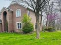 Beautiful two-story brick home with a well-maintained yard and mature trees at 5773 Station Hill Dr, Avon, IN 46123