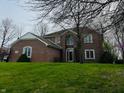 Traditional brick home with a well-manicured lawn and mature trees in a desirable location at 5773 Station Hill Dr, Avon, IN 46123