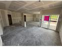Spacious living room ready for customization with sliding door to the back yard at 5924 Trichel Dr, Greenwood, IN 46143