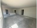 Large, unfinished living area is ready for customization with lots of bright, natural light at 5924 Trichel Dr, Greenwood, IN 46143