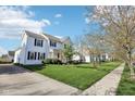 Charming home with lush green lawn and sidewalk, perfect for enjoying neighborhood strolls at 715 Stockbridge Dr, Westfield, IN 46074