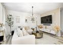 Inviting living room with plush seating, modern lighting, and a sleek entertainment center at 7239 Governors Row, Avon, IN 46123