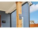Close up of a wooden porch column, showing address and mail slot on a charming two-story home at 1158 Burdsal Pkwy, Indianapolis, IN 46208
