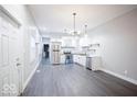 A bright, freshly-painted kitchen with stainless steel appliances and sleek cabinets, perfect for culinary endeavors at 117 W Arizona St, Indianapolis, IN 46225