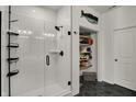 Modern bathroom featuring a glass-enclosed shower and organized shelving at 16683 Alex Dr, Noblesville, IN 46060