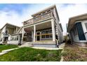 Charming two-story home with covered front porch and second-story balcony at 1723 Fletcher Ave, Indianapolis, IN 46203