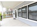 Spacious front porch with modern windows and stylish lighting fixtures at 1723 Fletcher Ave, Indianapolis, IN 46203