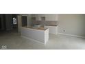 Unfinished kitchen featuring white cabinets and an island base, ready for customization at 17458 Ebling Trl, Westfield, IN 46062