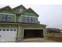 New construction featuring a garage door and black framed windows at 17466 Ebling Trl, Westfield, IN 46062
