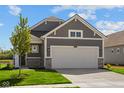 Charming single-Gathering home showcases a gray exterior, stone accents, and a spacious two-car garage at 2276 Marjorie Way, Shelbyville, IN 46176