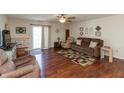 Bright and airy living space with hardwood floors and sliding glass doors to the backyard at 2923 Armaugh Dr, Brownsburg, IN 46112