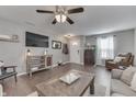 Spacious living room with hard wood floors and ample natural light at 3189 Underwood Dr, Whiteland, IN 46184