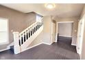 Open entryway showcasing hardwood floors, staircase and neutral paint at 3532 E 10Th St, Indianapolis, IN 46201