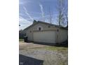 Detached two car garage with ample parking and a basketball hoop at 369 Northfield Dr, Mooresville, IN 46158