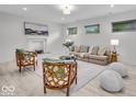 Bright living room featuring a fireplace, stylish seating, and a neutral color palette at 401 Sanders St, Indianapolis, IN 46225