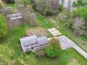 Expansive property features a well-maintained lawn, mature trees, and detached garage at 6113 N 250 E, Greenfield, IN 46140