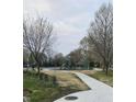 Outdoor playground with modern equipment and scenic walking path at 644 Warren Ave, Indianapolis, IN 46221
