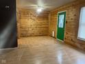 Living room featuring wood walls and laminate flooring at 6534 Redland Way, Indianapolis, IN 46217