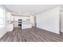 Spacious kitchen featuring white cabinets, stainless steel appliances, and a large central island at 6801 Seabiscuit Rd, Whitestown, IN 46075