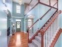 Grand foyer with high ceilings, hardwood floors, staircase, and natural light at 8181 Fairway Dr, Brownsburg, IN 46112