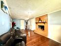 Cozy basement area with brick fireplace and comfortable seating at 8231 Trevellian Way, Indianapolis, IN 46217