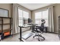 Bright office space featuring large windows, a modern desk, and comfortable ergonomic chair at 8330 Dumfries Dr, Brownsburg, IN 46112